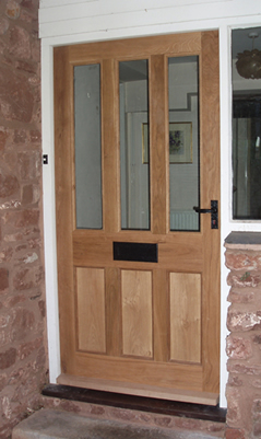 Oak front door with black door fittings